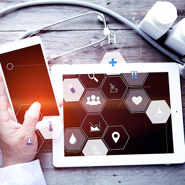 Photoillustration of a smartphone, tablet and medical supplies