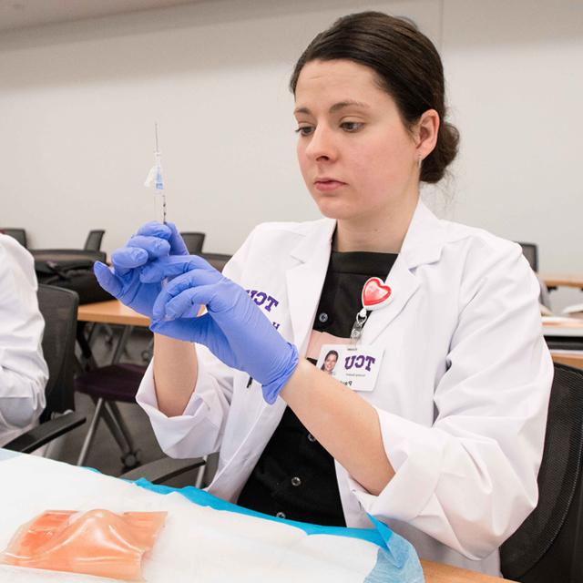 A nursing student in wound care class